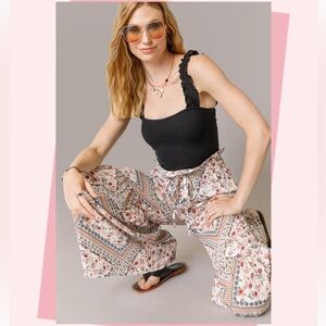 Francesca’s Tiered Floral Bell Bottom Hippie Pants M